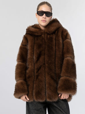 A model wearing a luxurious brown faux fur coat with a hood, styled with sleek black sunglasses, showcasing MEOTINE's elegance.