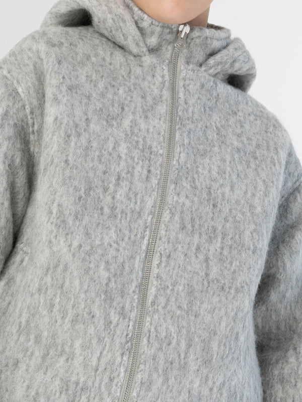 Cozy gray hoodie with a zip closure and a hood, perfect for casual wear. Ideal for layering in cooler weather by MEOTINE.