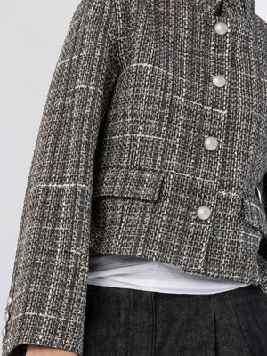 Stylish cropped jacket in a textured fabric with pearl buttons, perfect for a chic look. By MEOTINE.