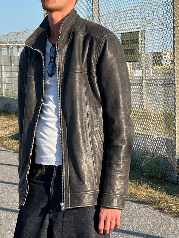 Stylish black leather jacket from MEOTINE, featuring a sleek design and a modern fit, perfect for casual outings.