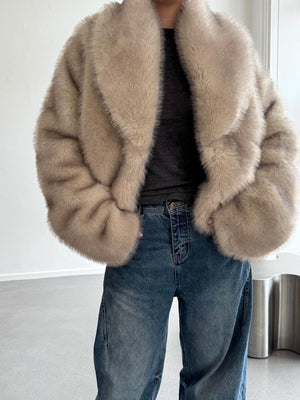 Cozy beige faux fur jacket with a wide collar, paired with casual blue jeans, showcasing a stylish look by MEOTINE.