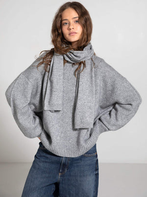 Cozy gray oversized sweater with a matching scarf, styled casually with relaxed jeans, showcasing MEOTINE's chic comfort.