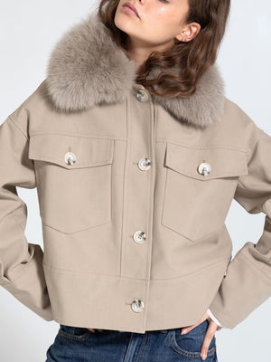 Stylish beige jacket with a plush fur collar, featuring large front pockets and button closure, perfect for a chic look by MEOTINE.