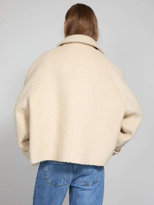 Cozy cream-colored oversized jacket with a soft texture, perfect for layering, designed by MEOTINE.