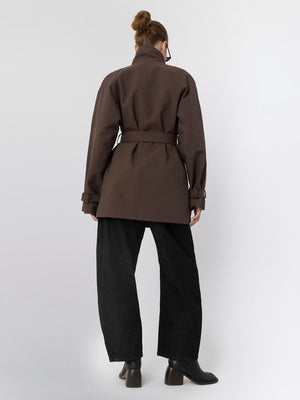 Stylish brown belted coat from MEOTINE, featuring a high collar and relaxed fit, paired with wide-leg black trousers.