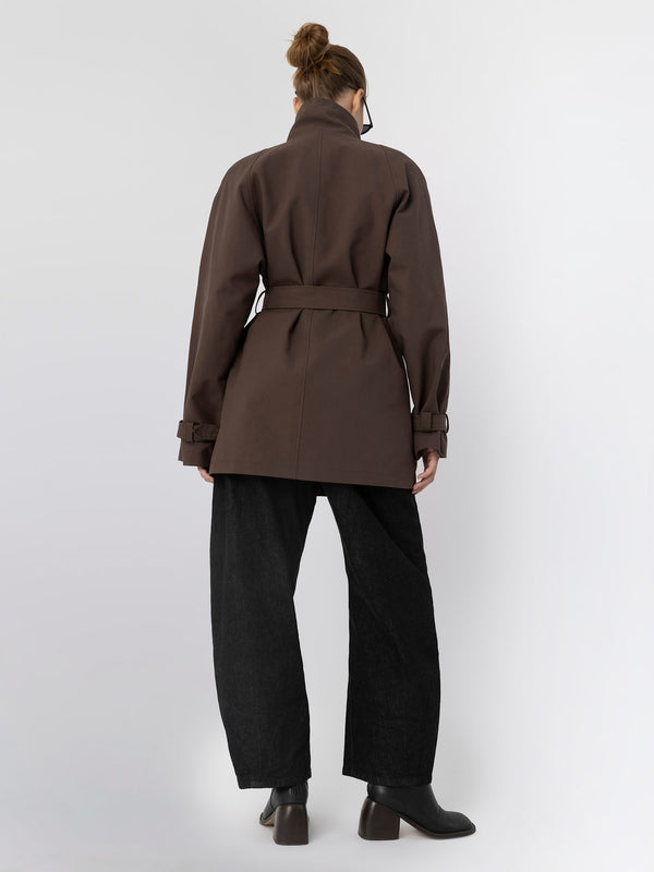 Stylish brown belted coat from MEOTINE, featuring a high collar and relaxed fit, paired with wide-leg black trousers.