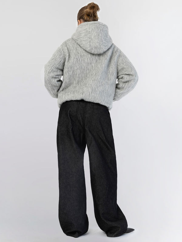 Cozy gray hoodie with a relaxed fit, paired with wide-leg black pants, showcasing a casual yet stylish look by MEOTINE.