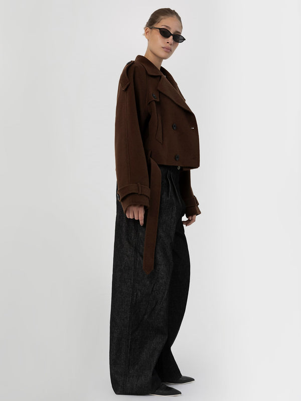 A model showcases a stylish brown cropped jacket paired with wide-leg black trousers, embodying MEOTINE's modern aesthetic.