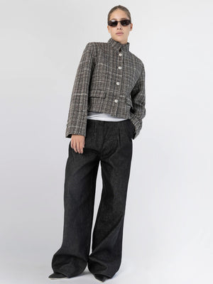 A model showcases a stylish cropped jacket paired with wide-leg black pants, exuding a chic vibe for MEOTINE.