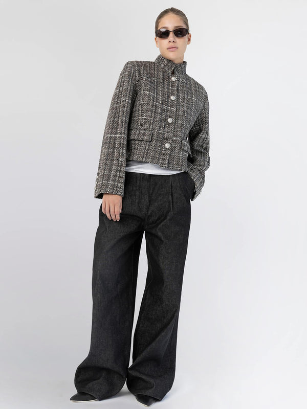 A model showcases a stylish cropped jacket paired with wide-leg black pants, exuding a chic vibe for MEOTINE.