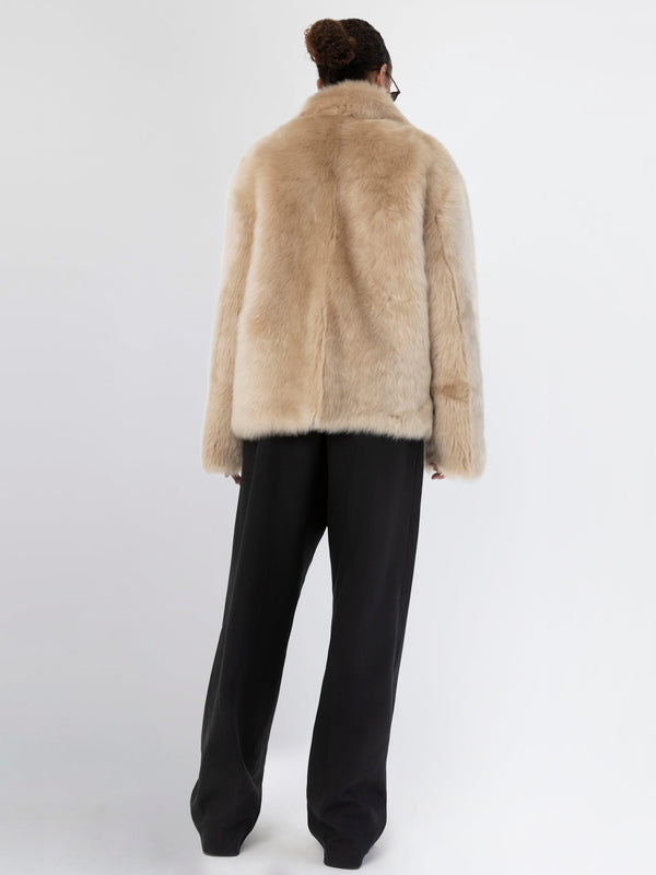 Luxurious beige faux fur coat from MEOTINE, featuring a relaxed fit and elegant design, perfect for stylish winter layering.