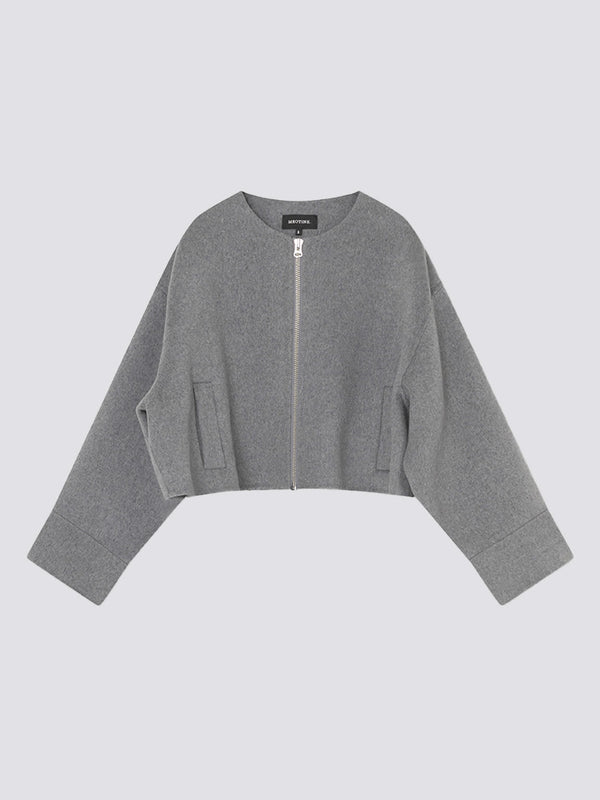 Gray cropped jacket with a zip front and wide sleeves, featuring a minimalist design by MEOTINE. Perfect for layering.