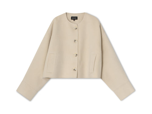 Beige cropped jacket with a round neckline and button closure, featuring side pockets for a stylish touch by MEOTINE.