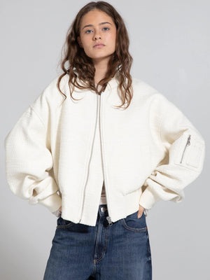 Cozy cream oversized jacket with a zip front and side pockets, perfect for a stylish, relaxed look by MEOTINE.