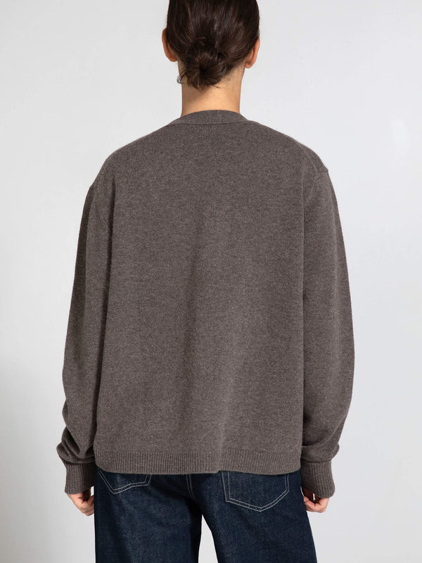 Cozy brown oversized sweater from MEOTINE, featuring a relaxed fit and ribbed cuffs, perfect for casual layering.