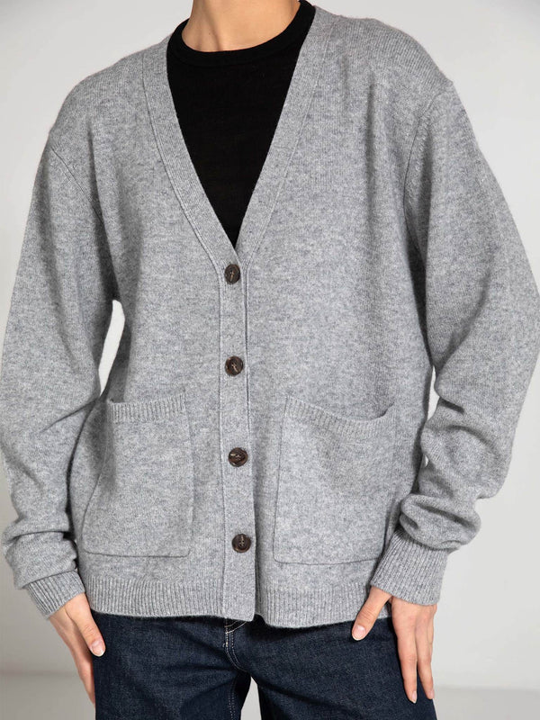 Cozy gray cardigan with a V-neck, button closure, and front pockets, perfect for layering. By MEOTINE.