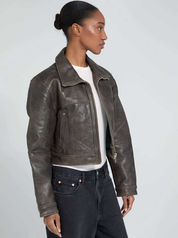 Stylish cropped leather jacket in dark brown, featuring a classic collar and side pockets, perfect for a chic look by MEOTINE.