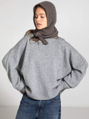 Cozy gray oversized sweater paired with a matching scarf, showcasing a relaxed style perfect for casual outings. MEOTINE.
