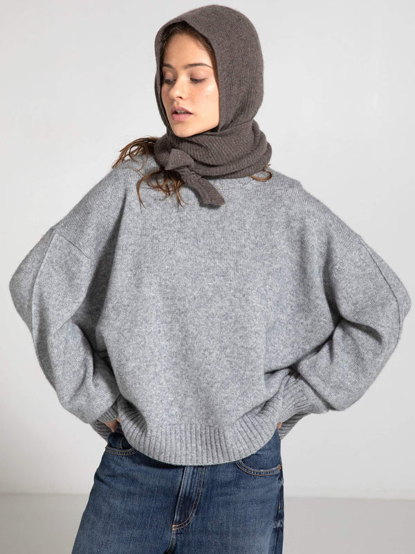 Cozy gray oversized sweater paired with a matching scarf, showcasing a relaxed style perfect for casual outings. MEOTINE.