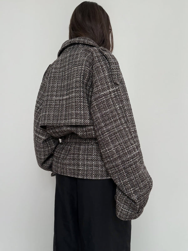Stylish oversized tweed jacket in brown and black tones, featuring a unique back design. Perfect for a chic, modern look by MEOTINE.