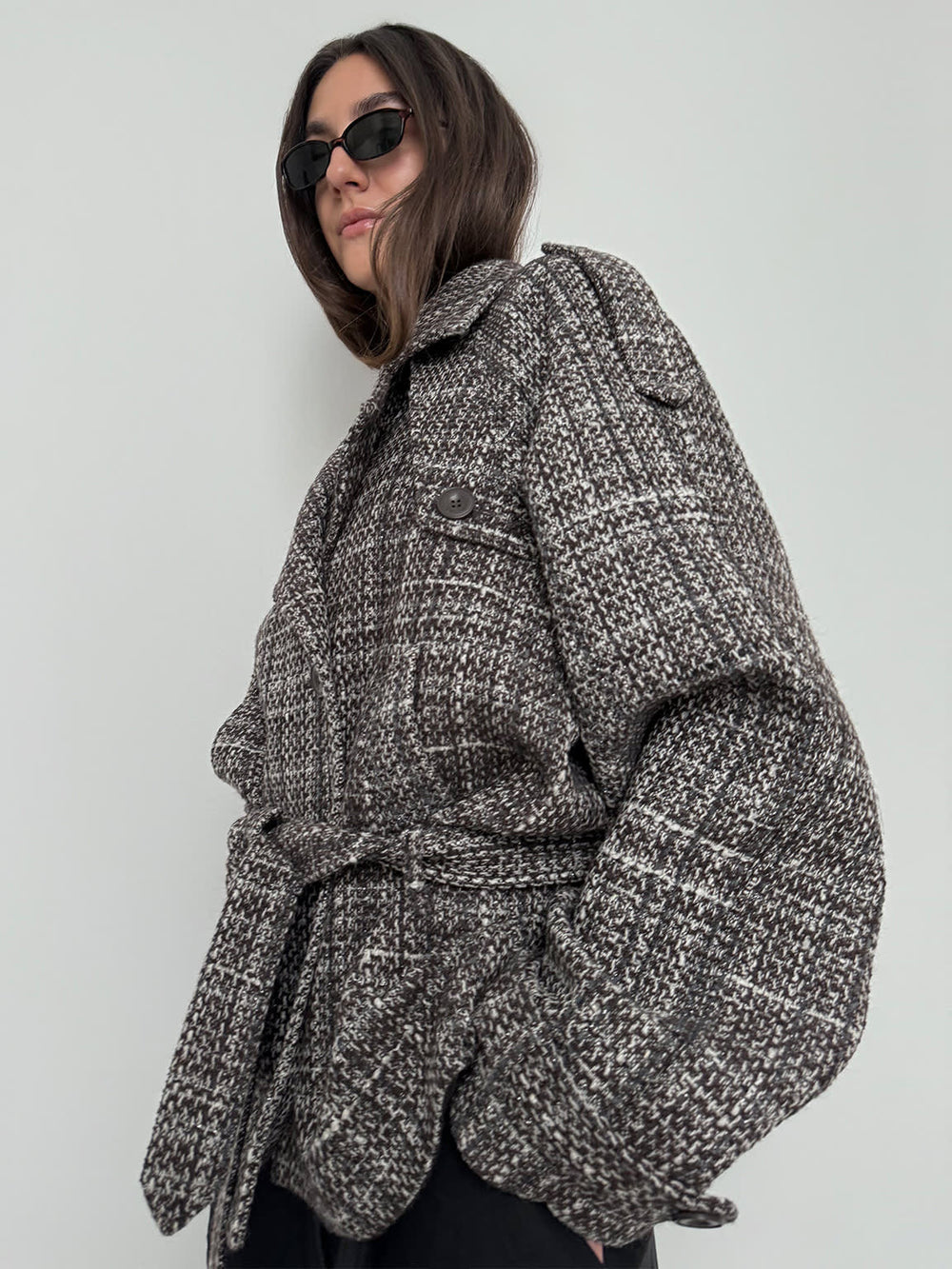 Stylish oversized brown plaid coat with a belted waist, worn by a model in sunglasses, showcasing MEOTINE's chic design.