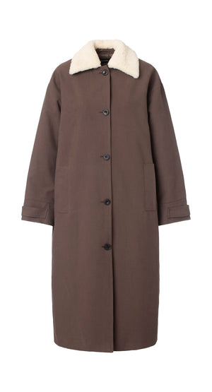Brown long coat with a soft white collar and button closure, featuring side pockets. Perfect for stylish warmth by MEOTINE.