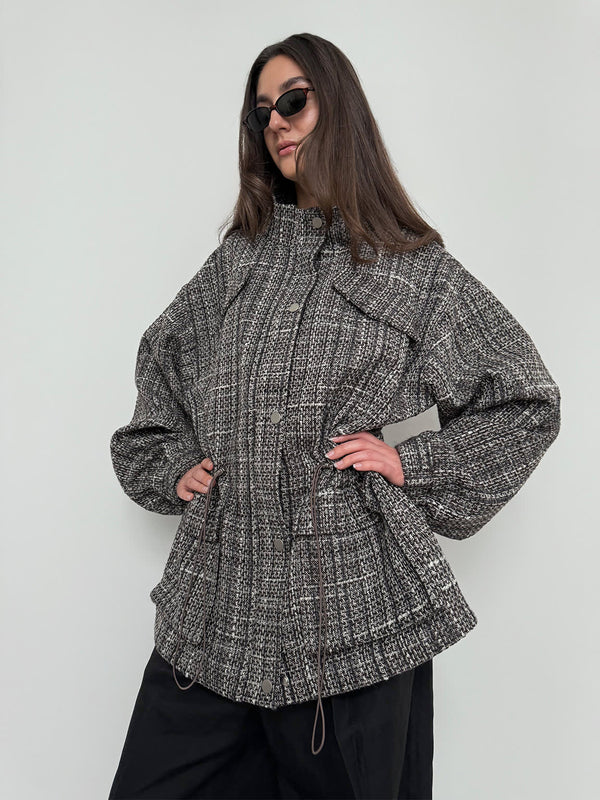 Stylish oversized jacket in a textured black and white pattern, featuring a cinched waist and relaxed fit, by MEOTINE.