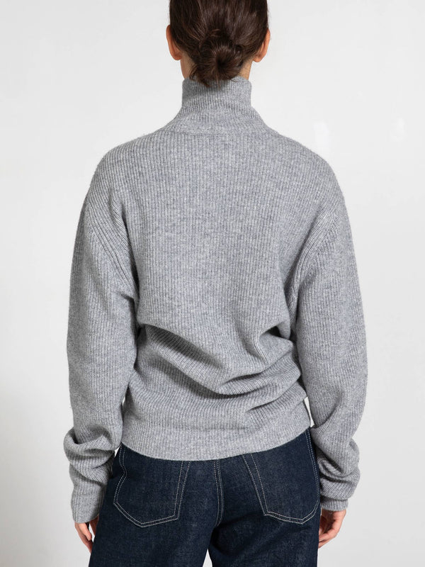 Cozy gray turtleneck sweater with a relaxed fit, perfect for layering. Ideal for casual outings or lounging at home. MEOTINE.