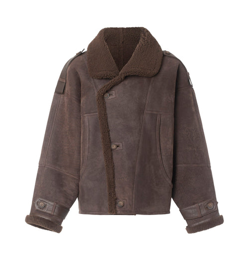 Brown shearling jacket with a cozy collar and button closure, perfect for stylish warmth. Ideal for winter outings by MEOTINE.