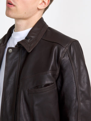 Brown leather jacket with a classic collar and front pocket, showcasing a stylish and modern design by MEOTINE.