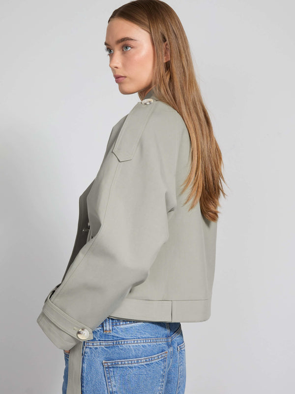 Stylish light gray jacket with a relaxed fit, featuring button details and a modern silhouette, perfect for casual wear by MEOTINE.