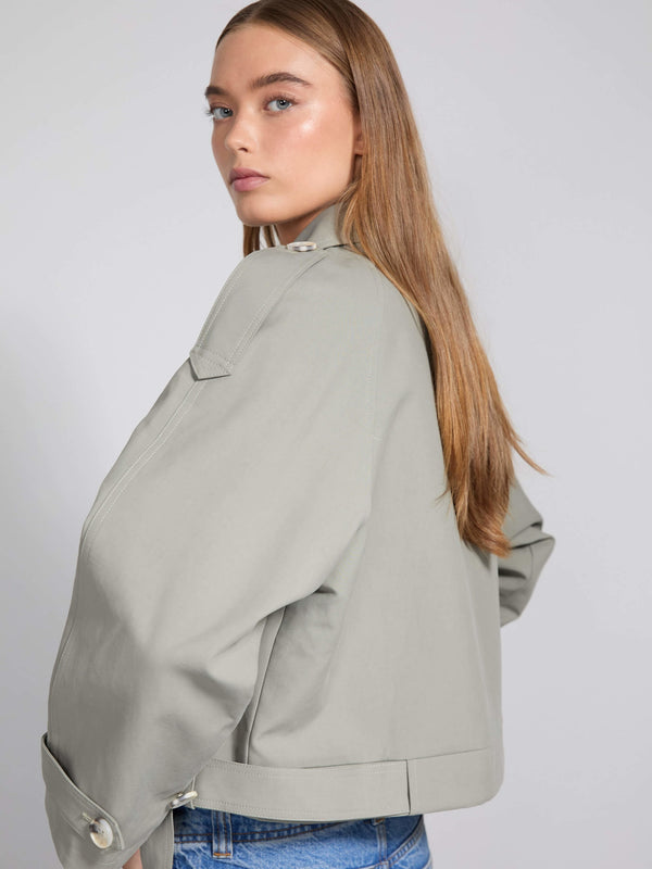 Stylish light gray jacket with a relaxed fit, featuring a high collar and button details, perfect for a modern look by MEOTINE.