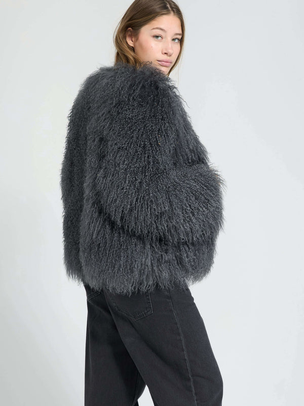 Cozy gray fluffy sweater with oversized sleeves, perfect for a stylish winter look. Designed by MEOTINE for comfort and warmth.