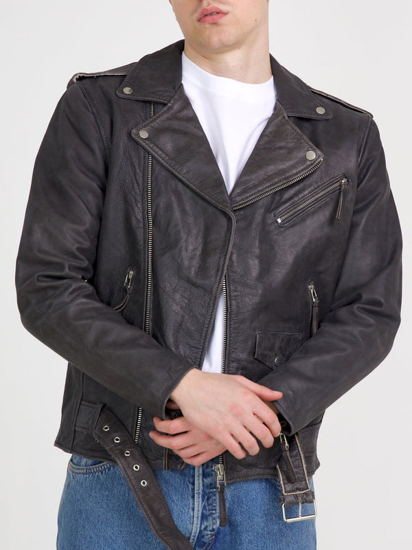 Stylish black leather biker jacket with a classic design, featuring zippers and a belted waist, perfect for a trendy look. MEOTINE.