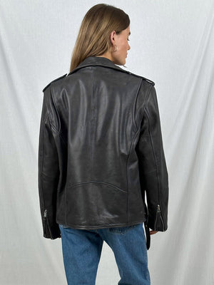 Stylish black leather jacket with a classic design, featuring shoulder epaulets and zippered cuffs, perfect for a trendy look by MEOTINE.