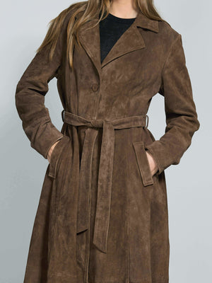 A stylish brown suede trench coat with a belted waist, featuring a classic collar and side pockets, perfect for a chic look by MEOTINE.
