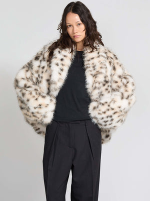 Luxurious MEOTINE faux fur coat with a spotted pattern, featuring a relaxed fit and wide sleeves, perfect for stylish layering.