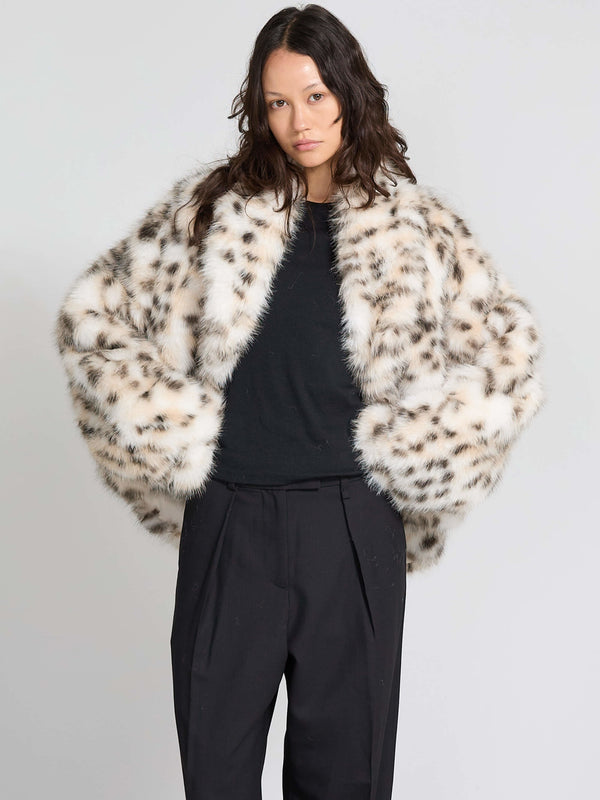 Luxurious MEOTINE faux fur coat with a spotted pattern, featuring a relaxed fit and wide sleeves, perfect for stylish layering.