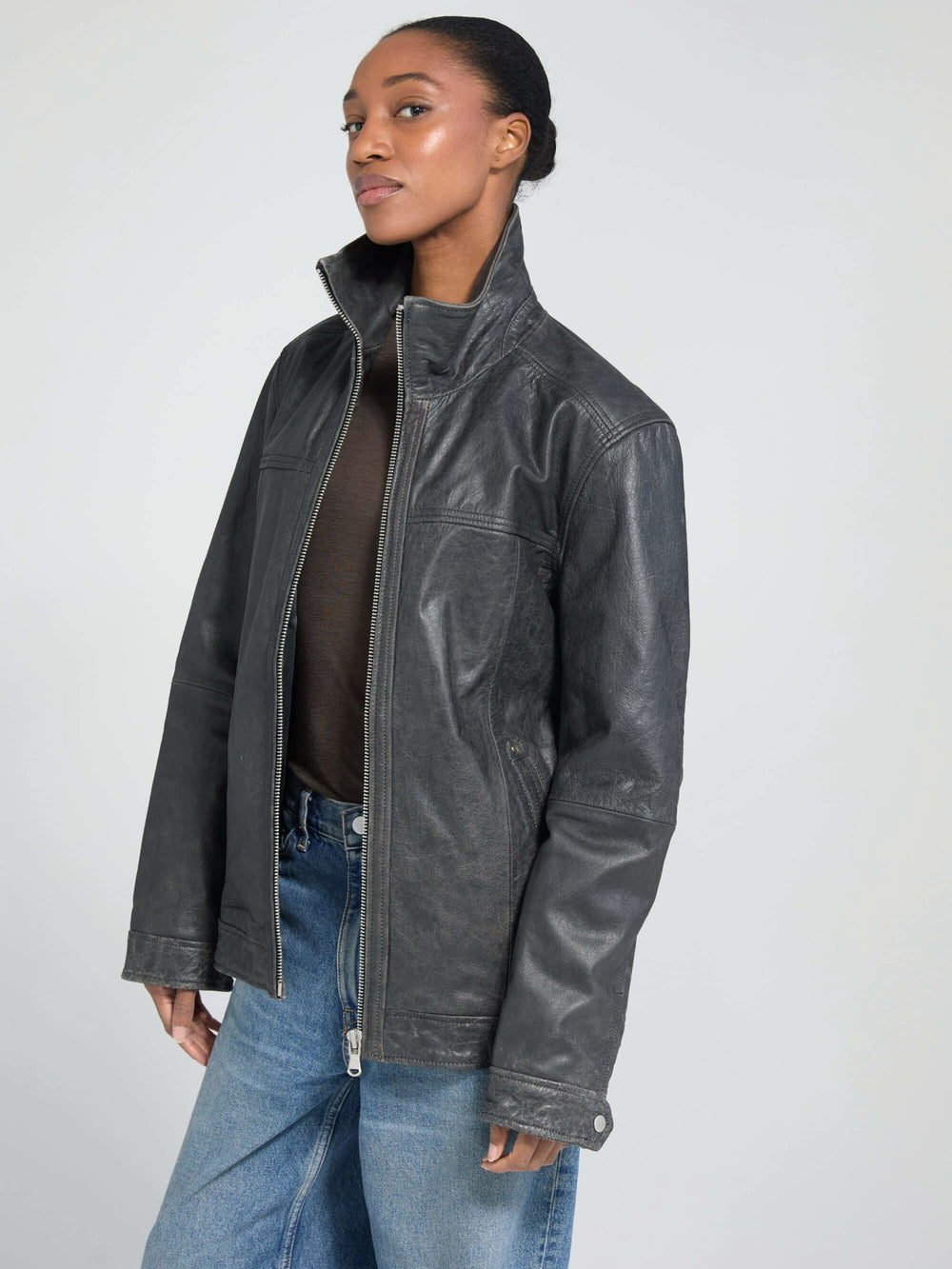 Stylish black leather jacket from MEOTINE, featuring a high collar and a relaxed fit, perfect for a chic, modern look.