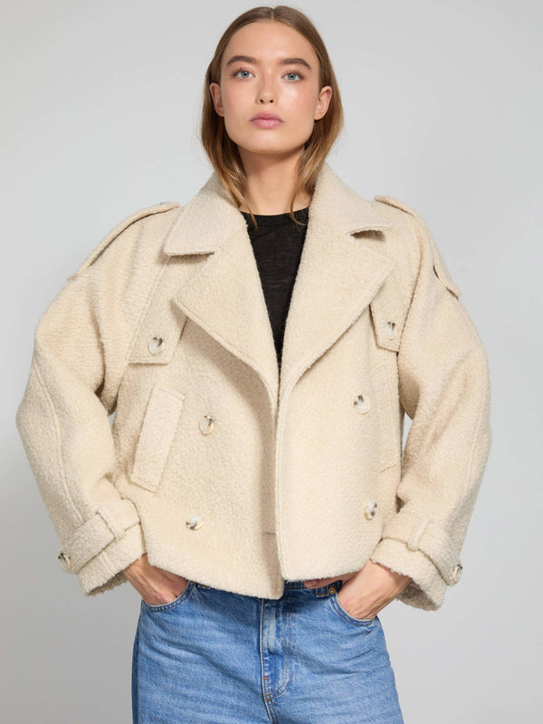 Cream-colored oversized jacket with a double-breasted design, featuring large buttons and a stylish collar, by MEOTINE.