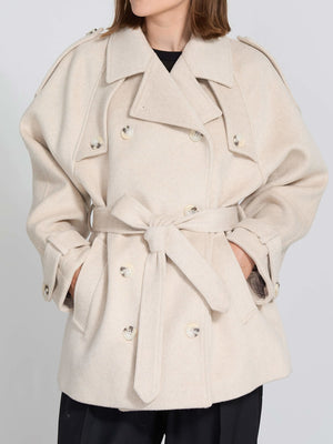 A stylish beige double-breasted coat with a belt, featuring large buttons and a relaxed fit, perfect for a chic look by MEOTINE.