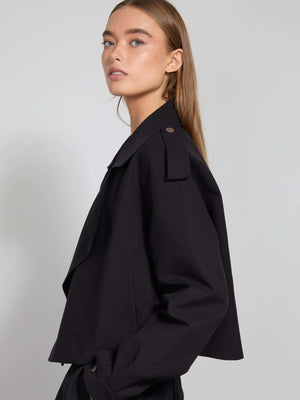 Stylish black cropped jacket with a relaxed fit, featuring a classic collar and button details, perfect for a chic look by MEOTINE.