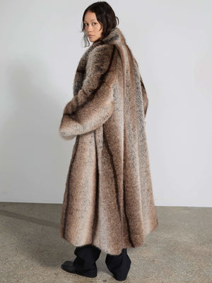 Luxurious oversized brown fur coat with a striking pattern, perfect for a stylish winter look by MEOTINE.