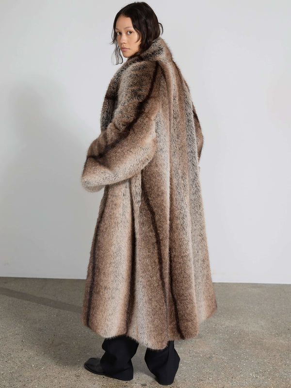 Luxurious oversized brown fur coat with a striking pattern, perfect for a stylish winter look by MEOTINE.