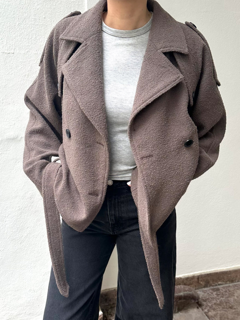Stylish brown MEOTINE jacket with a belted waist, featuring a classic trench design and oversized fit, perfect for layering.