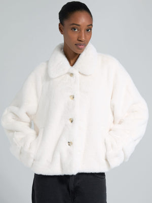 Cozy white faux fur jacket with a collar and button closure, perfect for stylish warmth. From MEOTINE's latest collection.