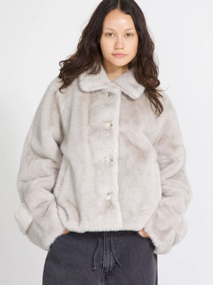 Cozy gray faux fur jacket with a button-up front and relaxed fit, perfect for stylish warmth this season by MEOTINE.