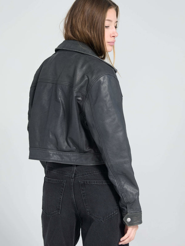 Stylish black leather cropped jacket from MEOTINE, featuring a classic collar and a fitted silhouette, perfect for a chic look.