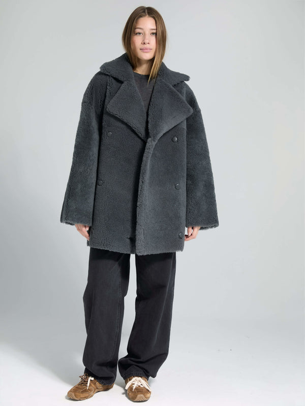 Cozy gray oversized coat with a double-breasted design, paired with relaxed black pants, showcasing MEOTINE's stylish warmth.