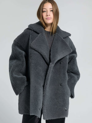 Cozy oversized gray coat with a plush texture and large lapels, perfect for stylish warmth this season by MEOTINE.